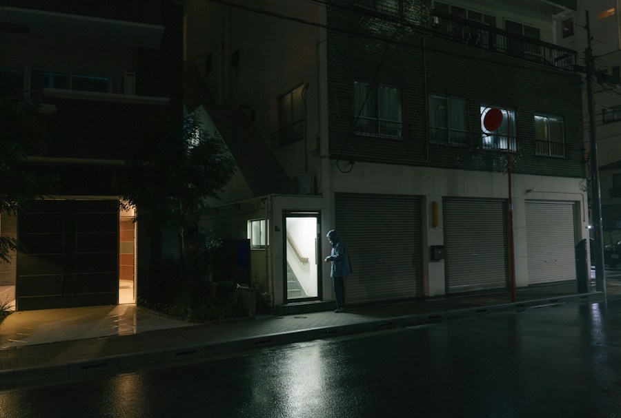 An empty street at night with a stop light