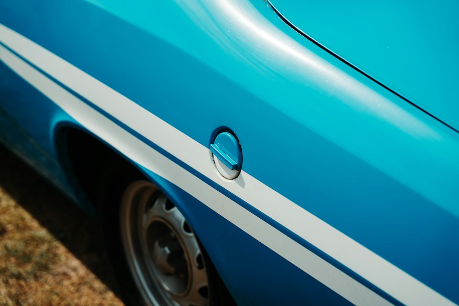 Blue classic car body with white racing stripes