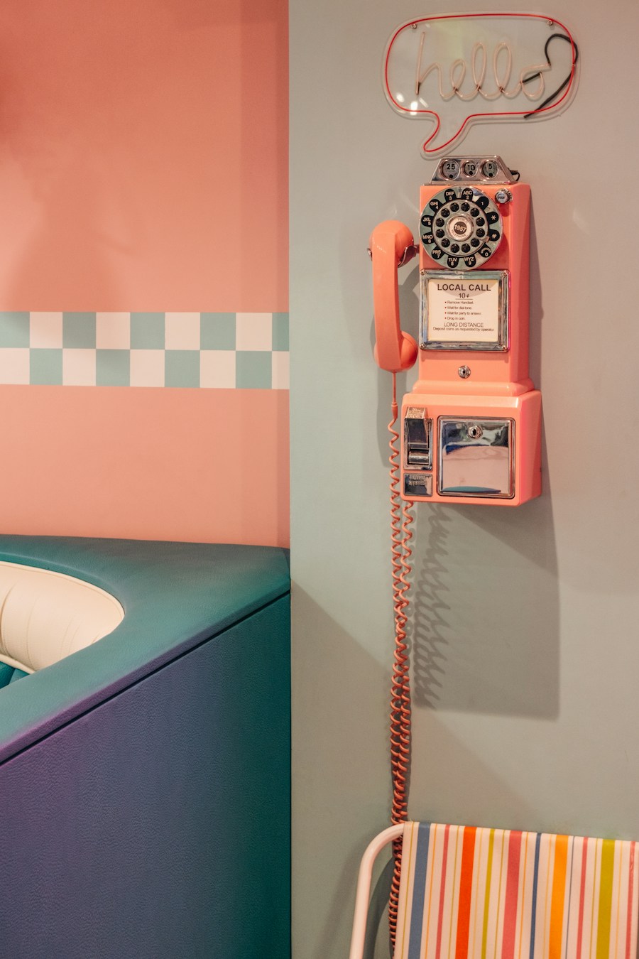 Pink retro payphone on a diner wall