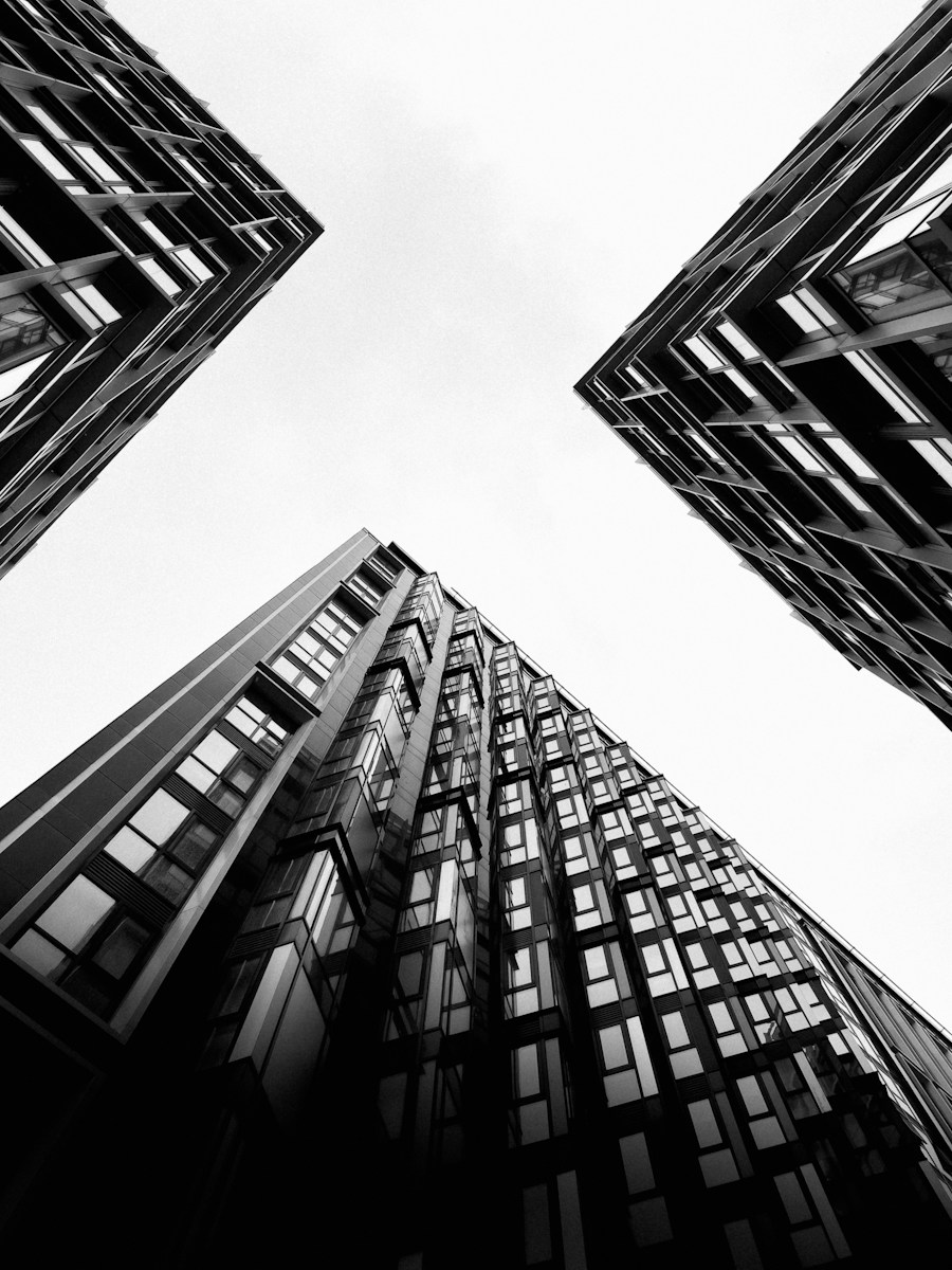 Modern towers seen from below in black and white