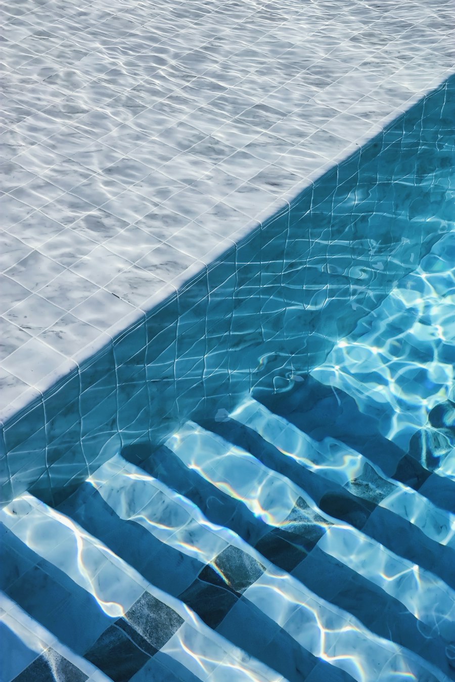 Steps leading into a clear swimming pool