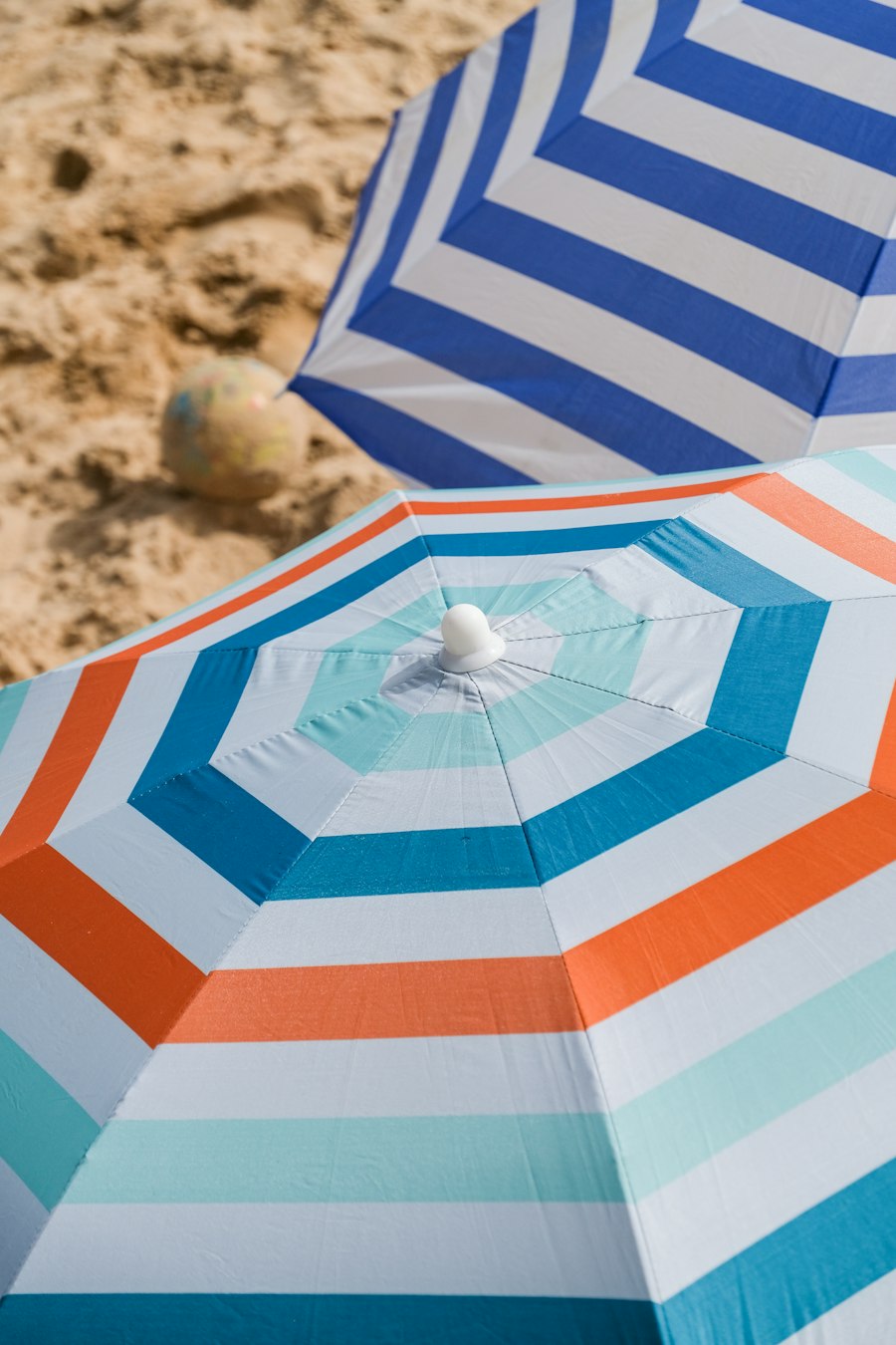 Striped beach umbrellas on the sand